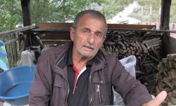 Baraj gölünde sel sularının sürüklediği odunlar temizleniyor