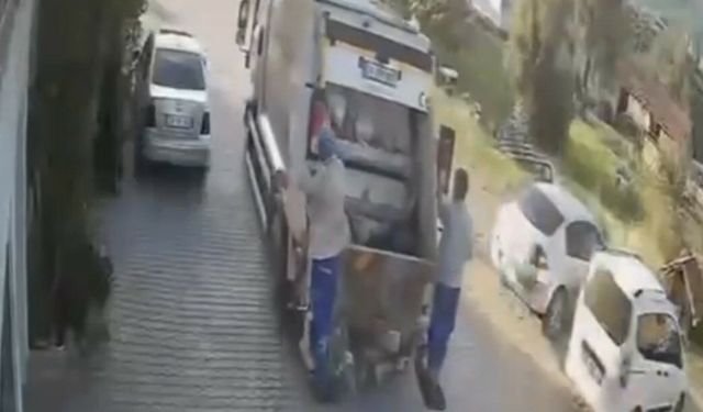 Çöp konteyneri çöp kamyonun peşinden sürüklendi; o anlar kamerada